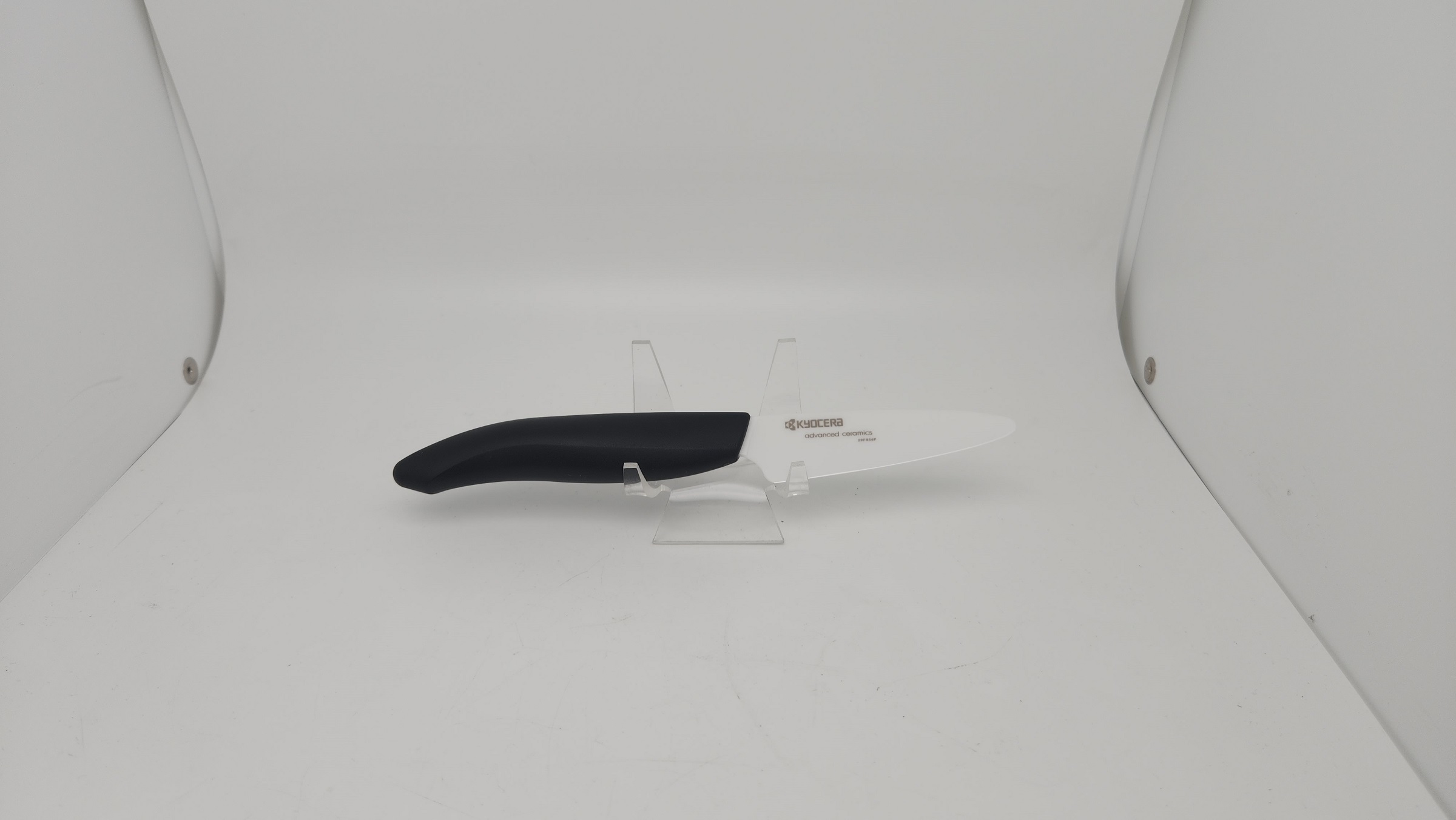 https://heimerdingercutlery.com/wp-content/uploads/2010/11/FK-075-WH-BK-Ceramic-Paring-Knife-3-IN-with-Black-Handle-by-Kyocera.jpg